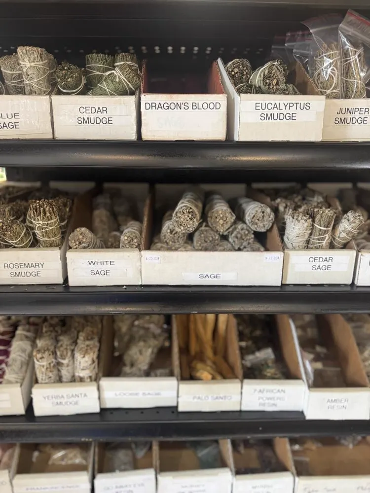 Labelled bins of sage, cedar, dragon blood resin and juniper